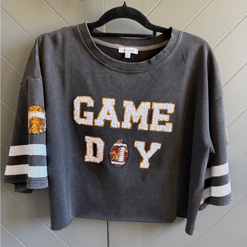 White Birch brand charcoal gray 'GAME DAY' sequin cropped oversized shirt.